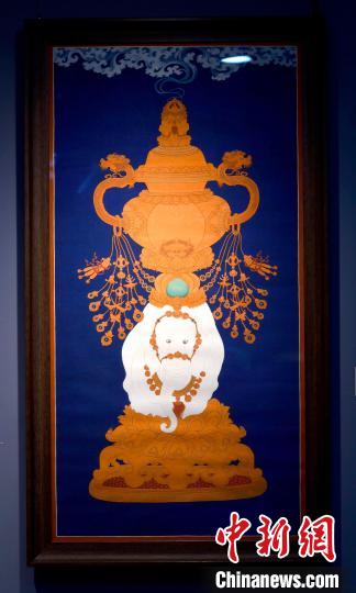 圖為5月16日，展覽中的新創(chuàng)唐卡作品《瑞象承香》?！±盍?攝