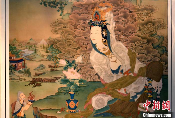 圖為5月16日，展覽中新創(chuàng)唐卡作品《靜息觀音》(局部)?！±盍?攝